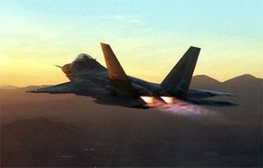 An F/A-22 Raptor in full afterburner during flight testing at Edwards Air Force Base, CA