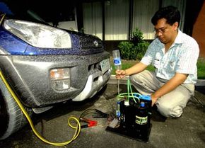A Filipino inventor, Glen Castillio, collects hydrogen from his portable hydrogen reactor which is connected to a 12-volt battery in the car. His reactor separates enough hydrogen from water to run an automobile engine.
