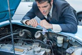 Man peering at engine