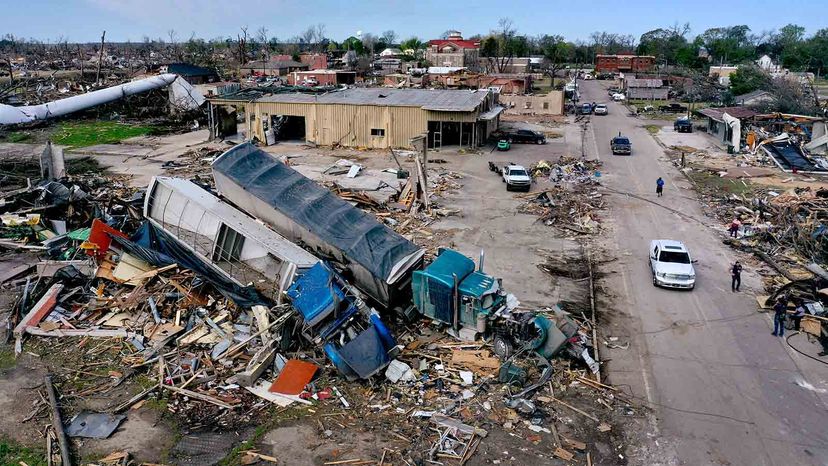 Piles of debris are all that's left where homes once stood before an EF-4 tornado leveled Rolling Fork, Mississippi, March 26, 2023, killing at least 26 people.”width=