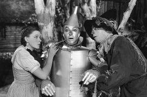 Dorothy and the Scarecrow oil the Tin Man in 'The Wizard of Oz.'