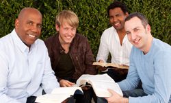 group of guys reading books