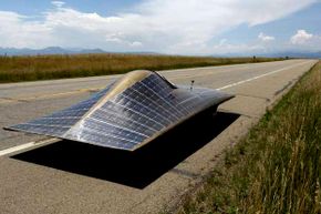 No need for a solar-paneled car if we come up with roads that can wirelessly provide power to an electric car.