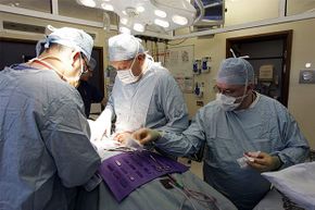 Consultant surgeon Andrew Ready and his team conduct a live donor kidney transplant at the Queen Elizabeth Hospital in Birmingham, England. Organs have a short shelf-life but designing custom implants could increase their lifespan.