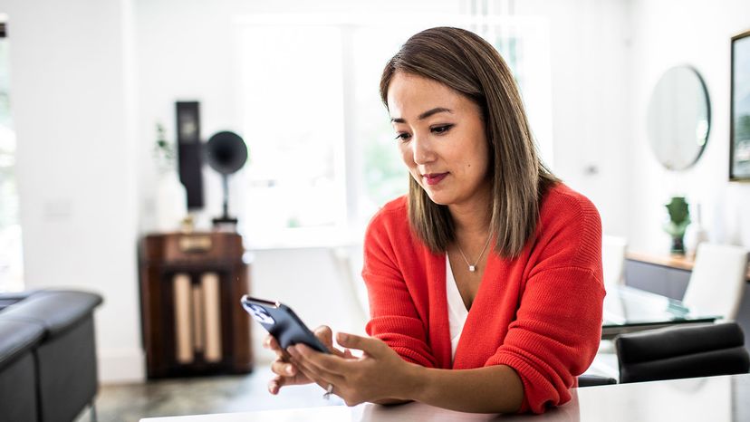 asian woman at iPhone