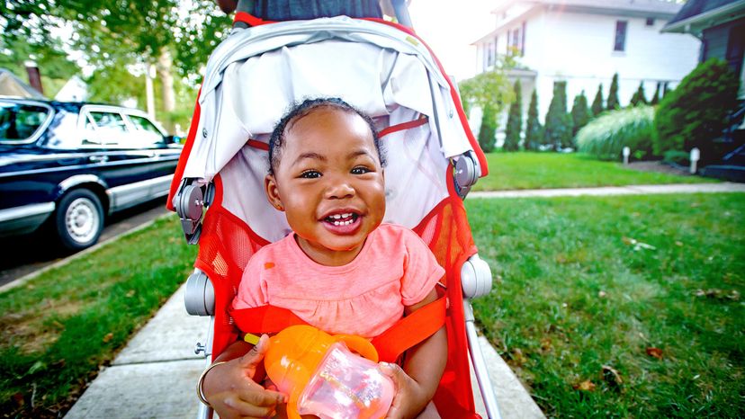 black baby girl in pushchair