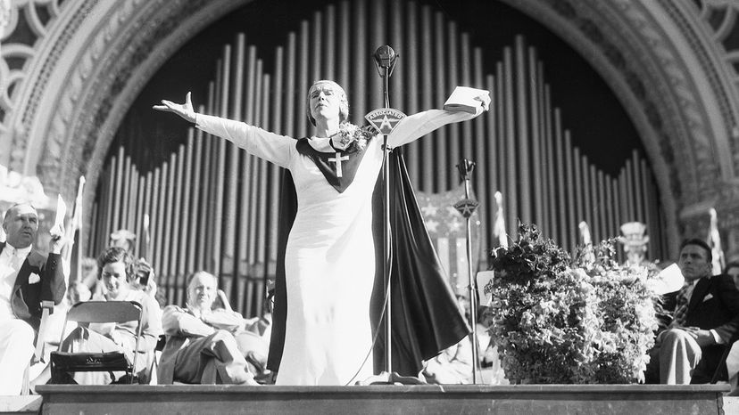 Twentieth-century evangelist Aimee Semple McPherson speaks in front of a crowd in 1935. Bettmann/Getty Images