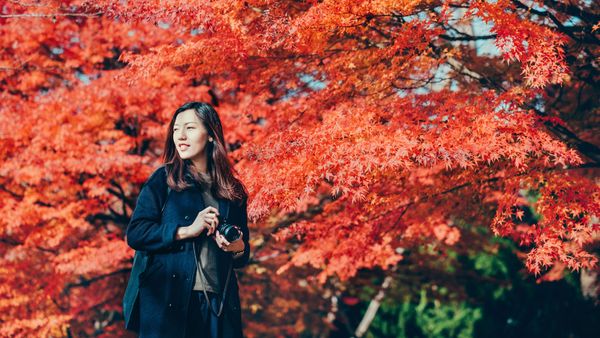 Asian woman with camera