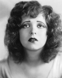 Clara Bow, the silent era's "It" girl, applied red lipstick in the shape of a heart or Cupid's bow.