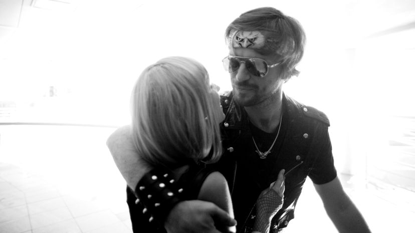 A black and white image of a rock and roll couple.