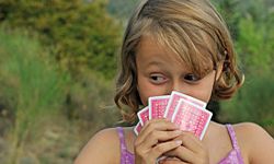 Girl playing outdoors alone.