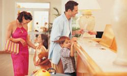 Parents and kids checking in at hotel