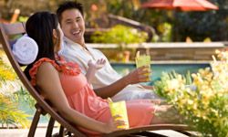 Asian couple relaxing on chairs