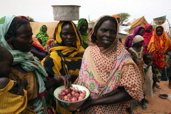 Women of indigenous African cultures outdoors.