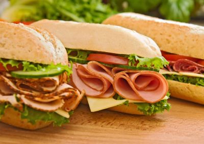 three fresh sub sandwiches