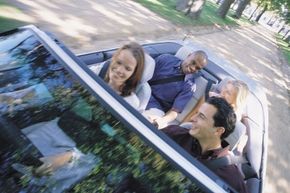 Four friends cruising down a road.