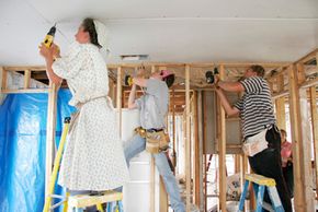 Volunteers from the Mennonite Disaster Service help to rebuild housing damaged by hurricanes in Florida.