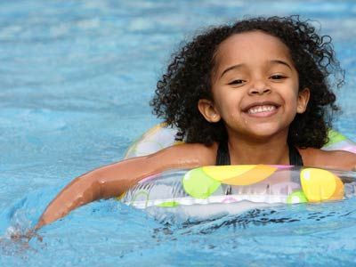 girl in inner tube in pool