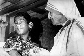 Mother Teresa comforts the Indian wolf boy Shamdeo at her charity home 'Prem Niwas' in Lucknow in 1980. 