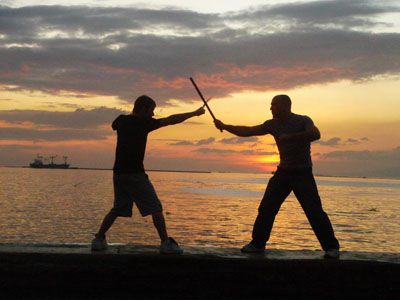 Doug and Jimmy with swords.