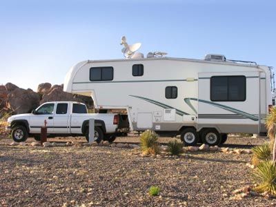A truck and a fifth wheel trailer
