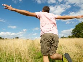 man running through field