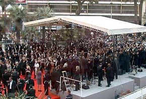 Celebrities walking the red carpet at the Cannes Film Festival.
