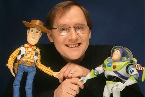 'Toy Story' director John Lasseter is shown with two of his characters from the film, Woody (left) and Buzz Lightyear in 1996.