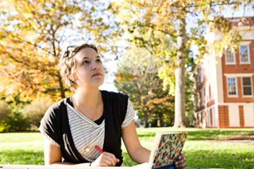 Student studying on college campus.