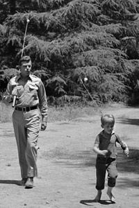 Retro style child outdoors togetherness amidst war.