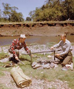 Men outdoors working in nature's beauty.