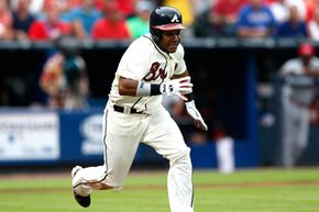 Jose Constanza of the Atlanta Braves runs to first base off a bunt in the fifth inning against the Cincinnati Reds at Turner Field, Atlanta.