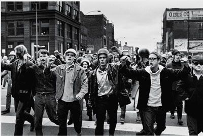 A large crowd of city life in black and white.