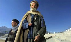 Abdul Jalil (forefront) stands inside Ghazi Stadium on Jan. 26, 2002, in Kabul, Afghanistan. Jalil lost his hand when the Taliban accused him of being a thief and cut it off as punishment.