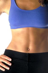 Athletic woman shows off flat belly.
