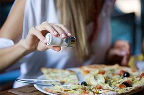 Salt on your pizza? Why not? Salt enhances the natural flavors  of just about anything.