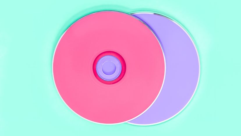 High angle view of pink and purple flexplay CDs