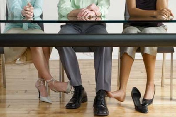 people playing footsie under the table