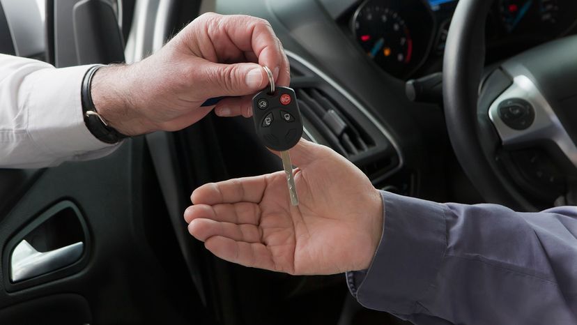 Car keys being handed over