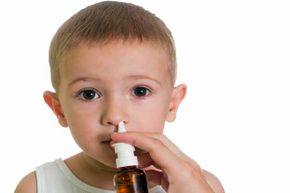The FluMist nasal spray vaccine, which is sometimes given to children,  does contain a live weakened virus but it could only cause an infection in the nose, nowhere else.