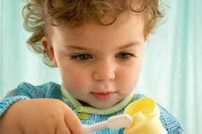 Don't let your toddler brush her teeth unsupervised -- even if you're using fluoride-free paste. It's important you coach her to spit out the toothpaste, not swallow it, at an early age.