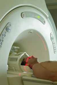 An MRI machine aims radio waves the body.