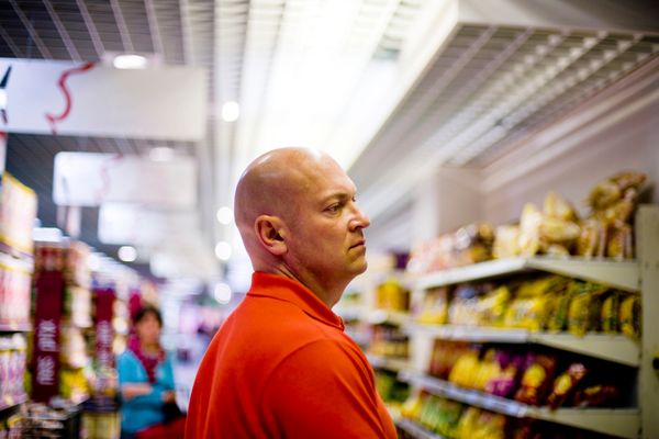Hungry Bald Man in a food store