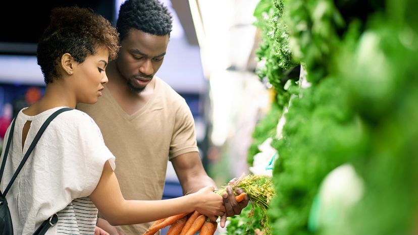 couple shopping for vegetables