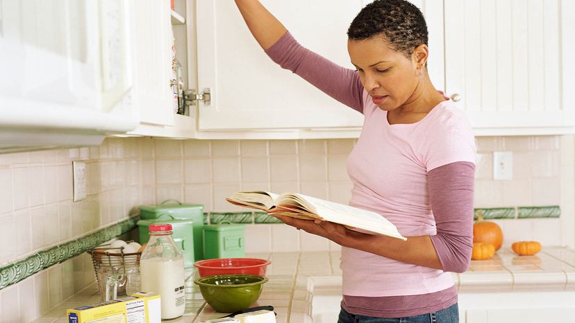 woman looking at recipe