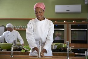 This cooking school student has learned the importance of hand-washing before preparing food.