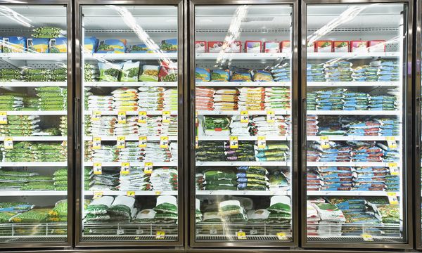 Food stocked shelves in retail supermarket.