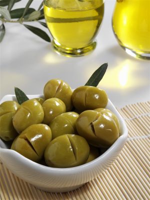 bowl of olives and bottles of olive oil