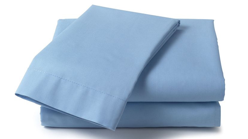 pile of blue folded sheets