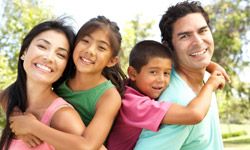 smiling family outdoors